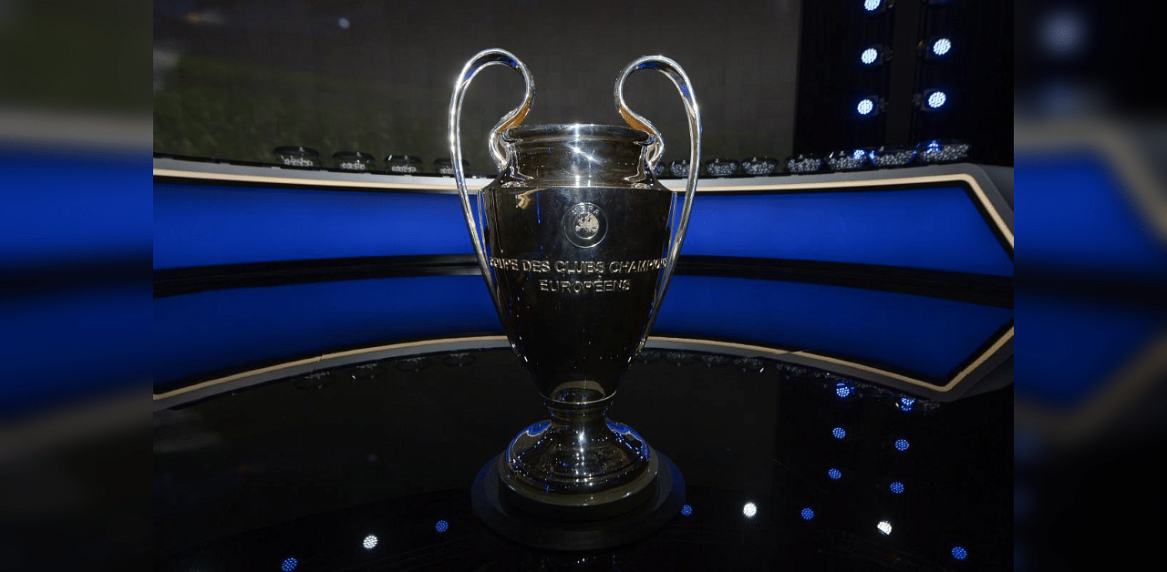 This handout picture taken and released by UEFA on October 1, 2020, shows the trophy displayed on set prior to the UEFA Champions League group stage draw at the RTS studios in Geneva. Credit: AFP Photo