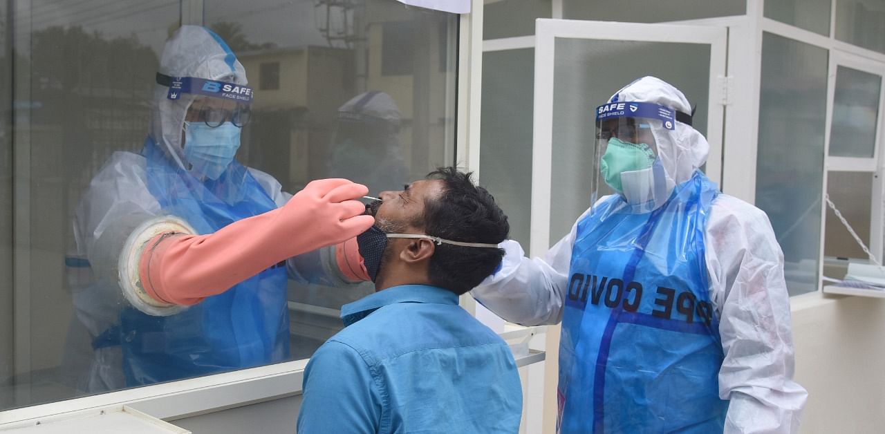 Medical staff collecting swab for Coronavirus test. Credit: TPML Photo