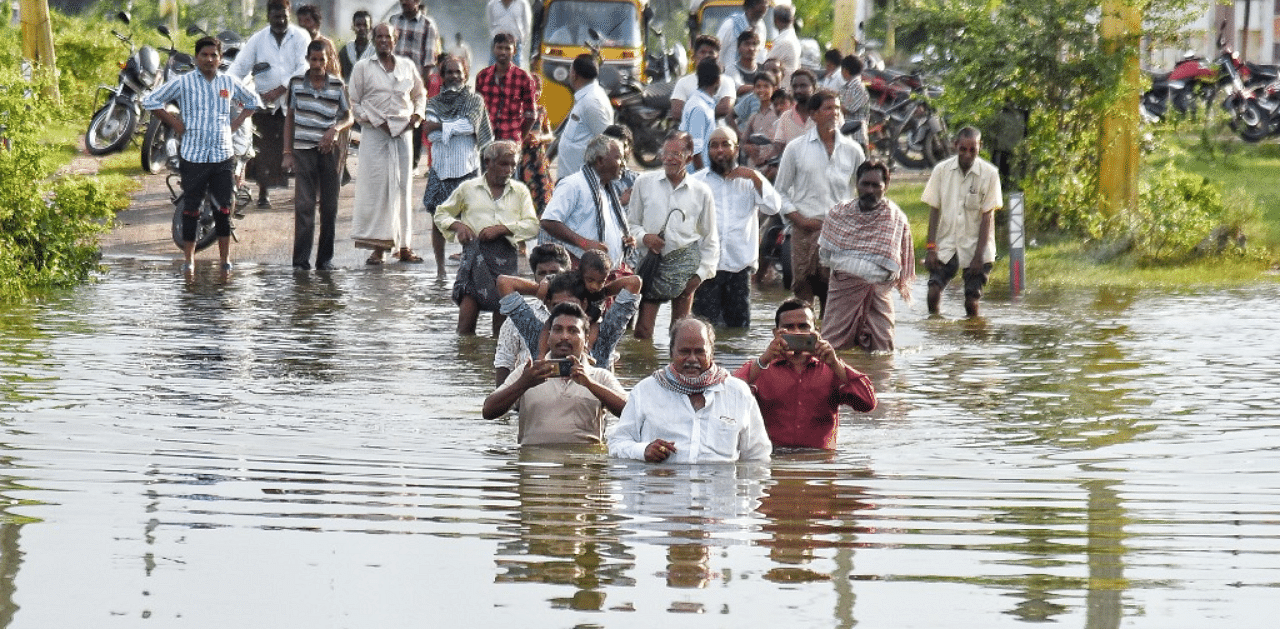 Krishna collector A Md Imtiaz visiting the flooded areas in the district on Friday. Credit: DH Photo/By Arrangement