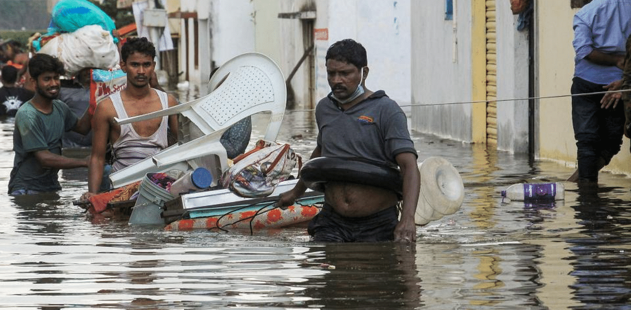 People shift to safer places along with their belongings from a flood-affected area, in Hyderabad, Friday, Oct. 16, 2020. Credit: PTI Photo