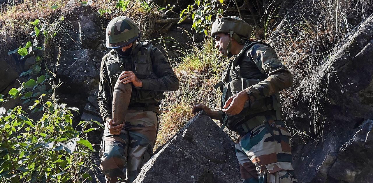 Bomb Disposal Squad (BDS) of Indian Army attempts to destroy live mortar shells, at Line of Control (LoC) Balnoi village of Mendhar subdivision in Poonch district. Credit: PTI Photo
