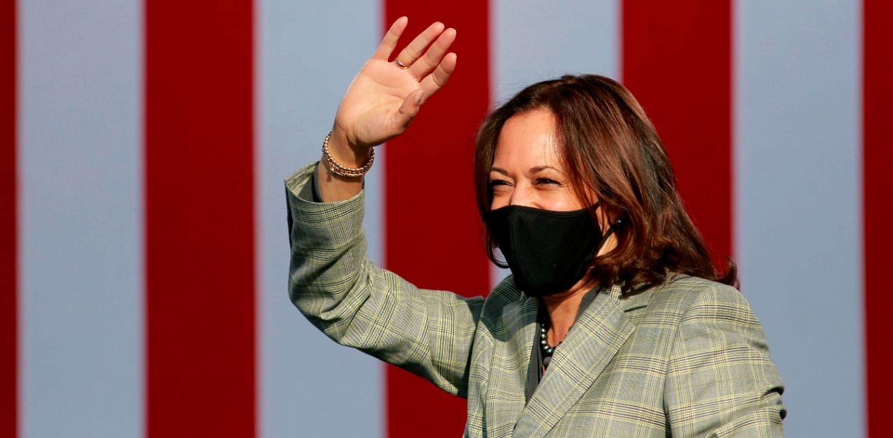 Democratic vice presidential nominee Kamala Harris waves to supporters at a voter mobilization drive-in event in Las Vegas. Credit: AFP Photo