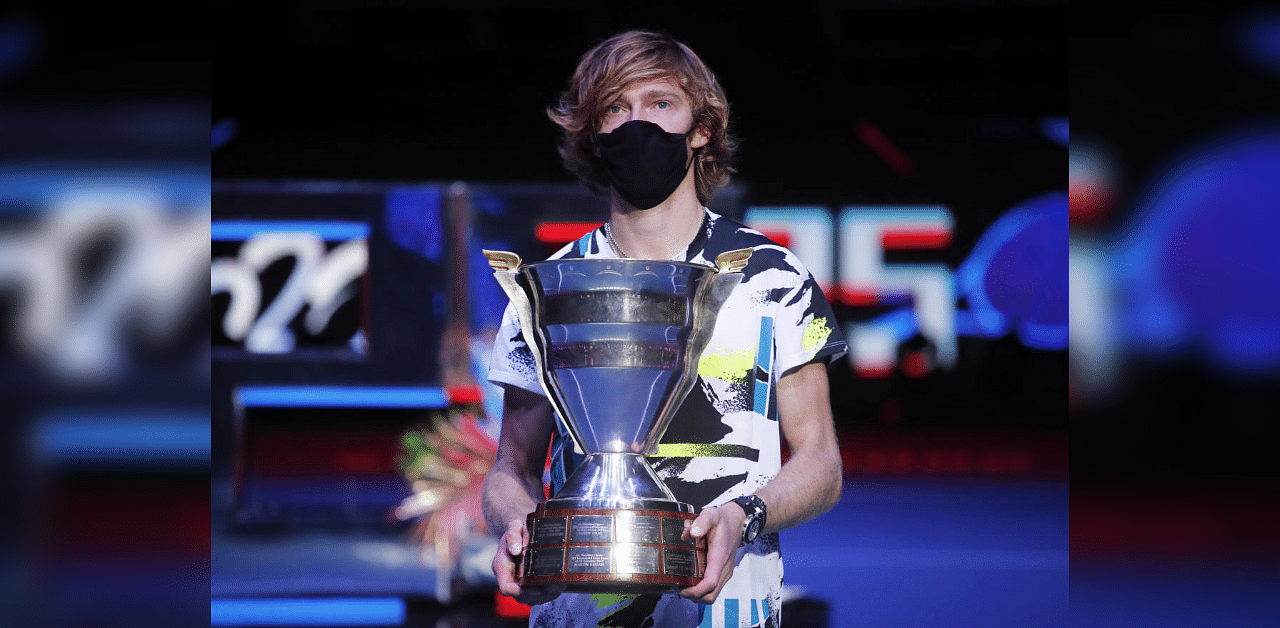 Russia's Andrey Rublev celebrates with the trophy after winning the final against Croatia's Borna Coric. Credit: Reuters Photo