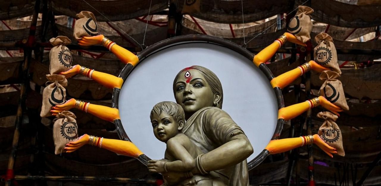 Durga Puja committees pay tribute to sufferings of migrant labourers. Credit: AFP Photo