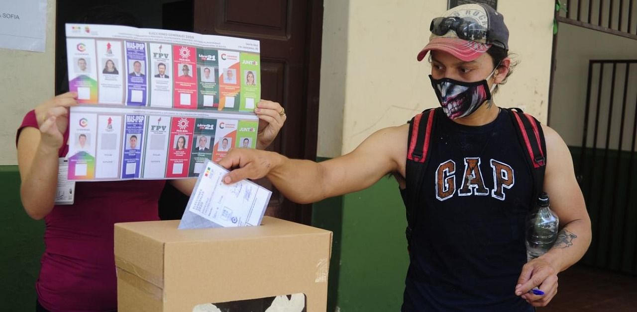 A man casts his vote at a polling station in Santa Cruz de la Sierra, Bolivia. Credit: AFP