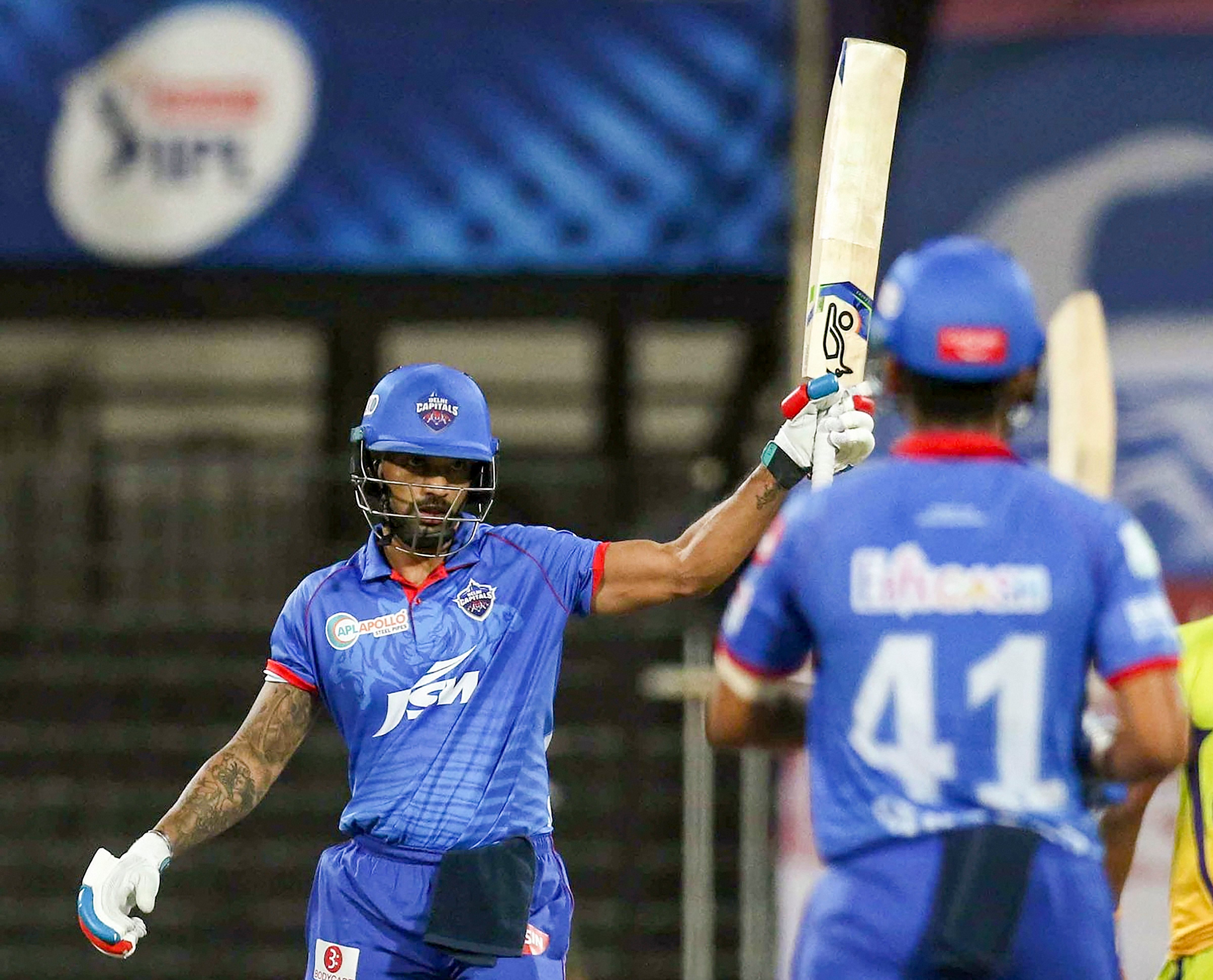  Delhi Capitals (DC) player Shikhar Dhawan celebrates after scoring a half century during their Indian Premier League (IPL) T20 cricket match against Chennai Super Kings (CSK), at the Sharjah Cricket Stadium in Sharjah, Saturday, Oct. 17, 2020. Credit: PTI Photo