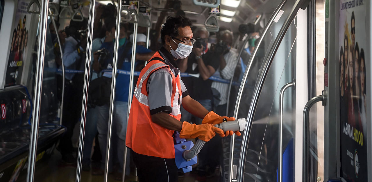 An employee sanitises a coach as the metro network prepares to resume services after more than a 6-month shutdown due to Covid-19. Credit: AFP Photo