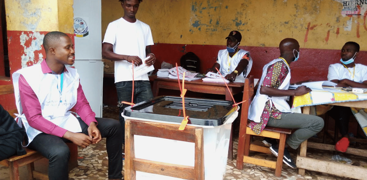 A man casts his ballot at a polling station during the Guinea's presidential election in Conakry. Credit: Reuters Photo