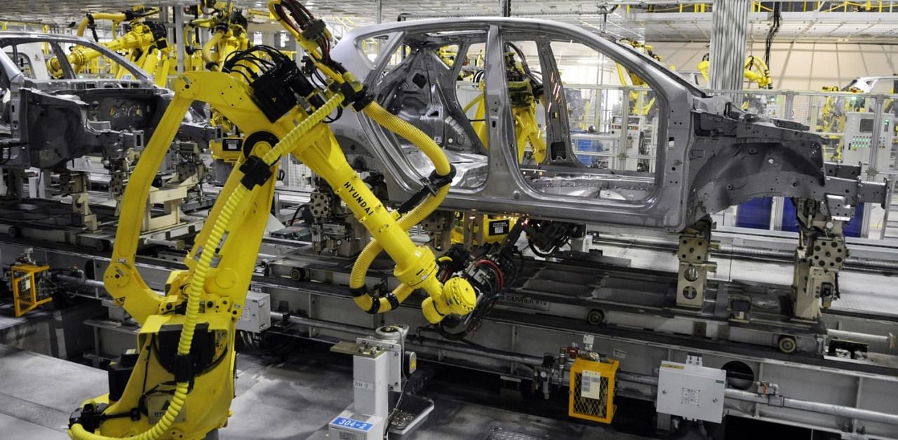 Greater automation risks creating higher income inequality, the economists wrote. Credit: Bloomberg Photo