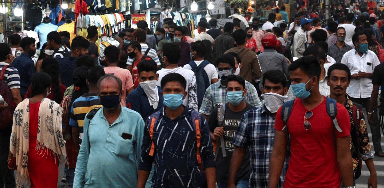 People gather in a market to shop ahead of the Hindu festival 'Durga Puja' in Kolkata. Credit: AFP Photo