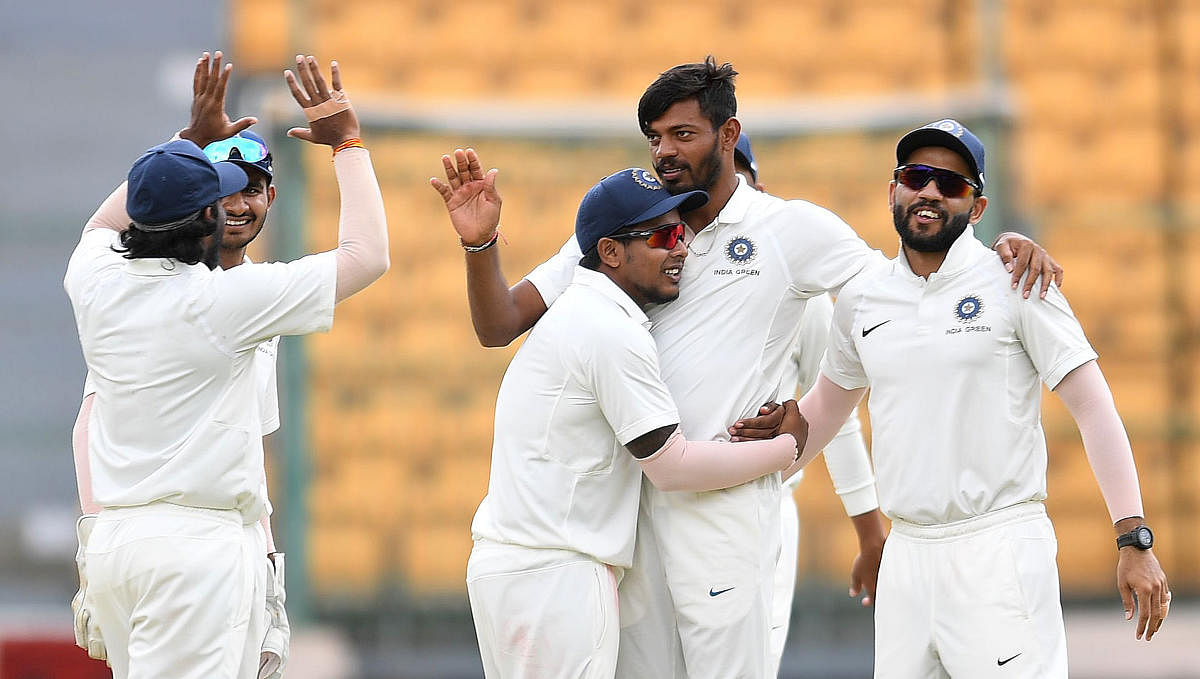 India Green paceman Ankit Rajpoot (second from right) celebrates with team-mates after dismissing India Red’s Mahipal Lomror on Friday. DH Photo/ Srikanta Sharma R