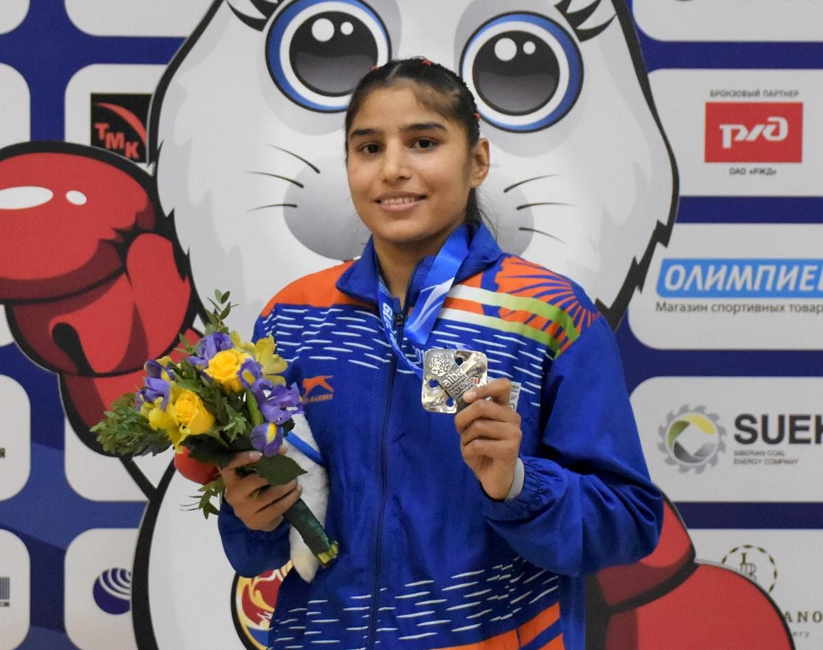 Manju Rani poses with with her silver medal (48 kg category) at the World Boxing Championships in Russia. PTI