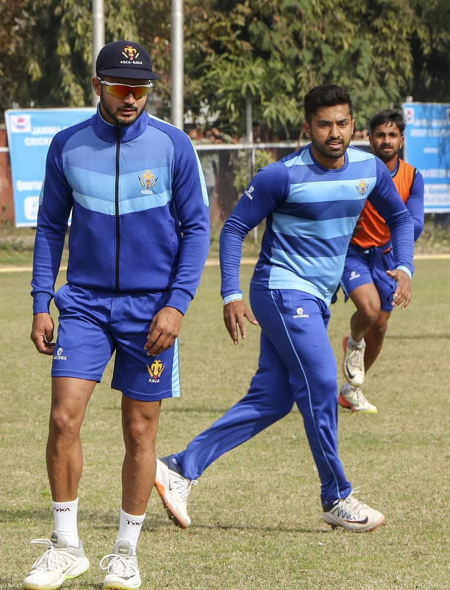 Manish Pandey (left), Karun Nair (centre) and R Samarth during a practice session in Jammu on Wednesday. PTI