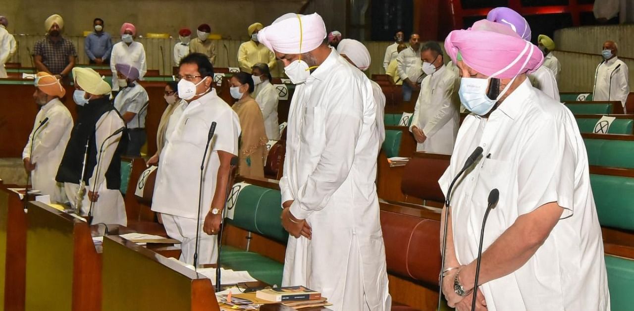 Punjab Chief Minister Capt Amarinder Singh along with other members pays homage to farmers who have lost their lives during the ongoing agitation over new farm laws. Credit: PTI