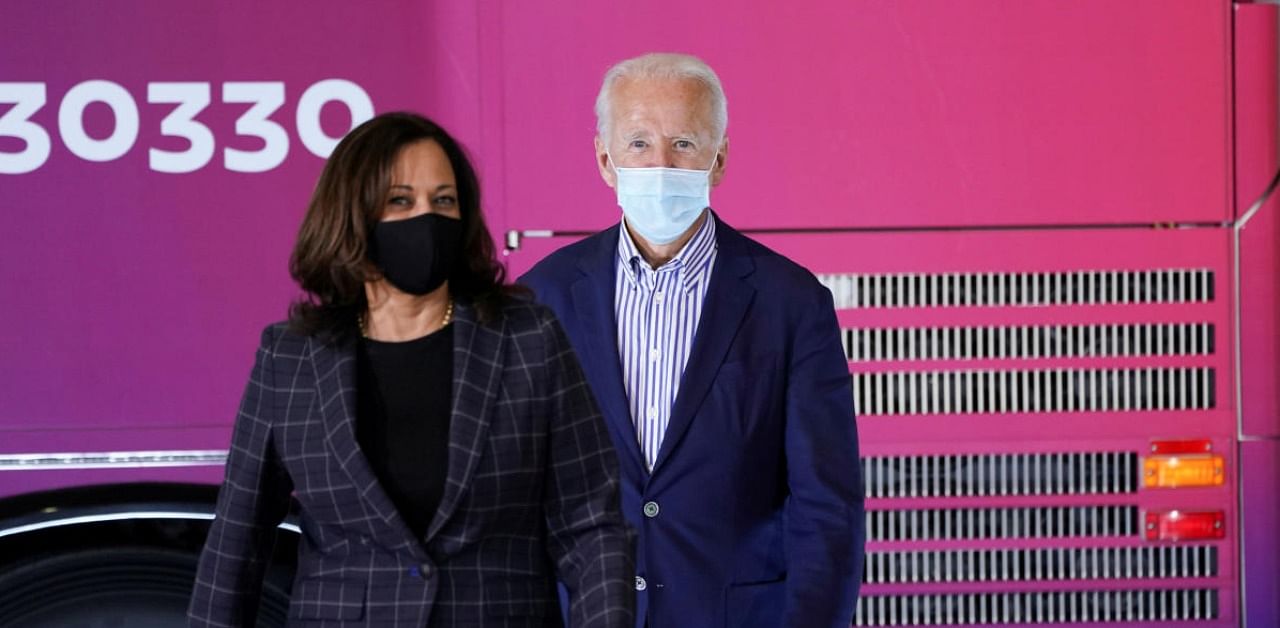 US Democratic presidential candidate Joe Biden and vice presidential candidate Kamala Harris arrive to speak at a carpenters union in Phoenix. Credit: Reuters.