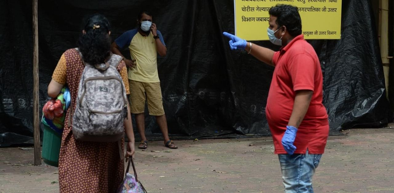A woman arrives at a Covid-19 Coronavirus testing centre, in Mumbai. Credit: AFP.