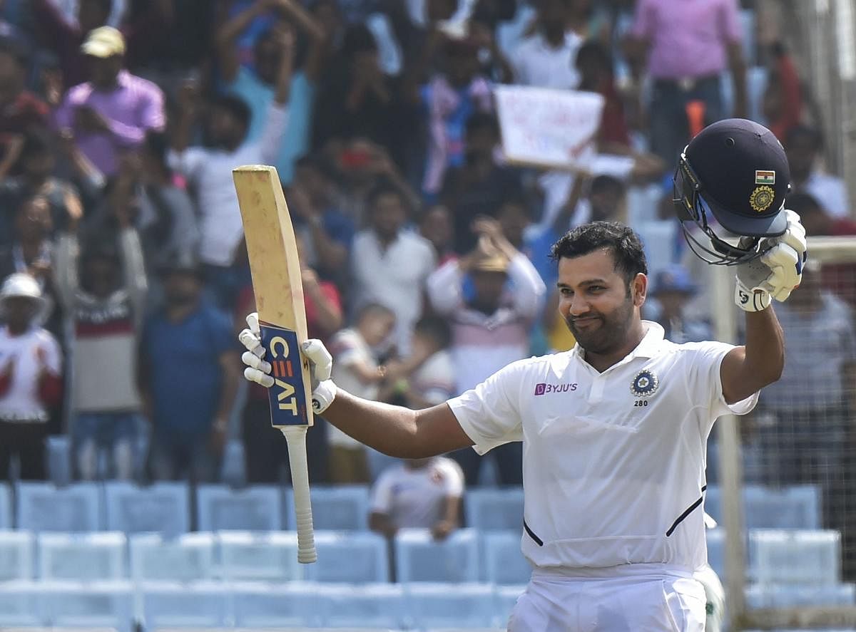 India's Rohit Sharma celebrates his double century during 2nd day of the 3rd cricket test match against South Africa at JSCA Stadium in Ranchi, Sunday, Oct. 20, 2019. (PTI Photo/Ashok Bhaumik) 