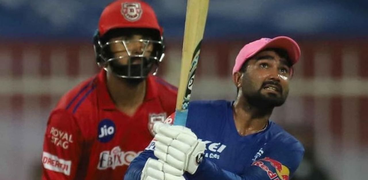 Rajasthan Royals batsman Rahul Tewatia plays a shot during the Indian Premier League 2020 cricket match against Kings XI Punjab, at Sharjah Cricket Stadium, Sharjah, Sunday, Sept. 27, 2020. (PTI Photo)