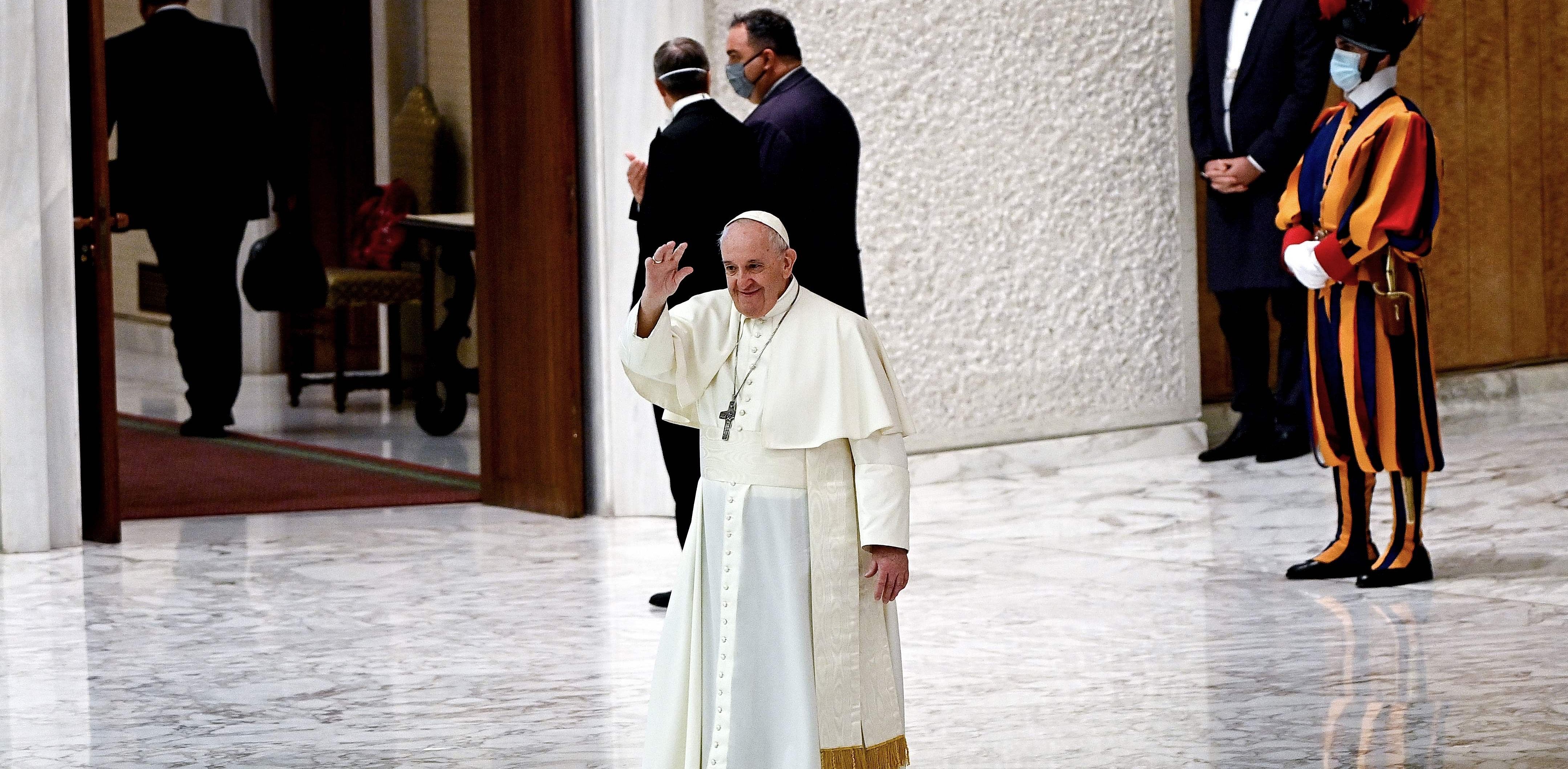 Pope Francis (C) waves at the end of his weekly general audience at the Paul VI hall at the Vatican. Credit: AFP