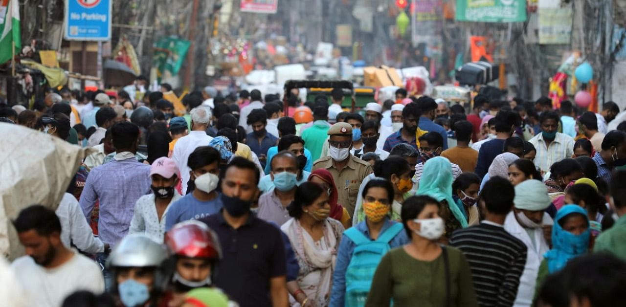 People are seen at a market amidst the spread of the coronavirus disease (COVID-19), in the old quarters of Delhi, October 19, 2020. Credit: Reuters Photo