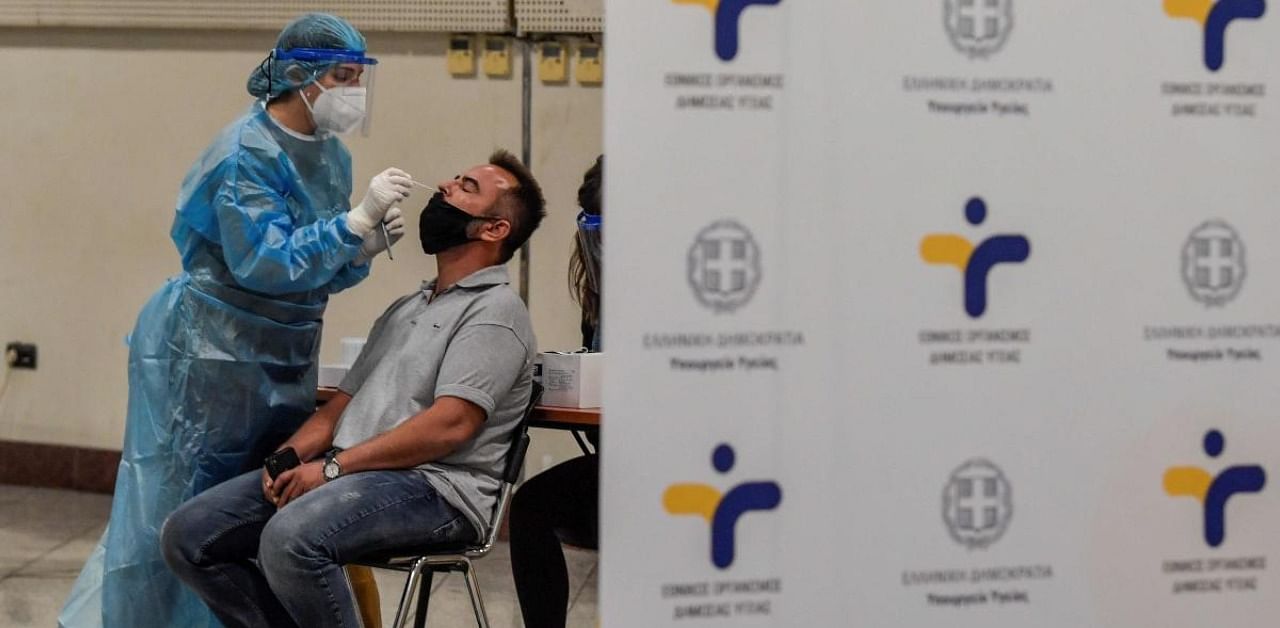 People get a free Covid-19 (coronavirus) test organised by the Greek National Health organisation at Athens central metro station. Credit: AFP