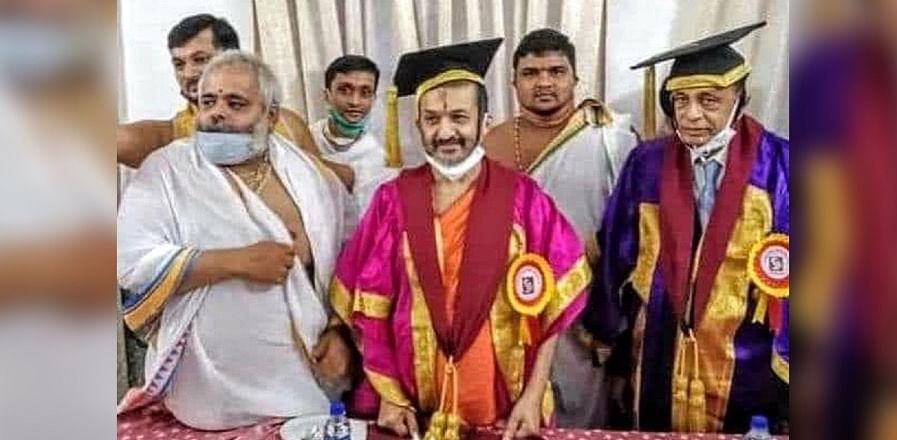 Palimar Mutt seer Sri Vidyadheesha Tirtha Swami was conferred Honoris Causa by Srinivas University during its second annual convocation in Mangaluru on Tuesday. Credit: DH Photo