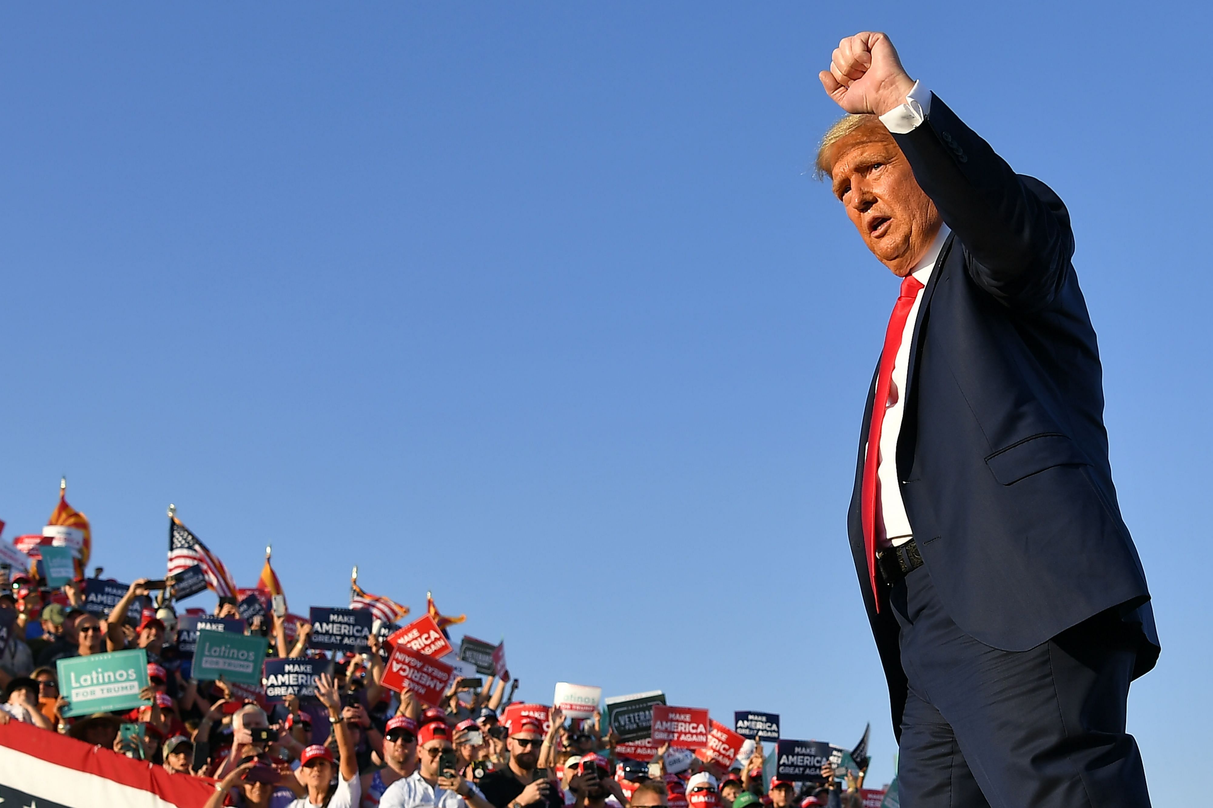 US President Donald Trump pumps his fist as he leaves a rally at Tucson International Airport in Tucson, Arizona on October 19, 2020. Credit: AFP Photo