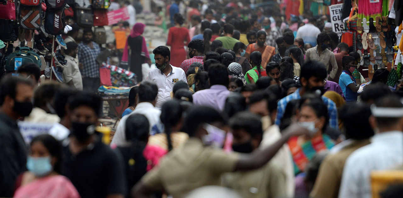 India will likely soon have the world's most COVID-199 coronavirus cases, but from Maharashtra's whirring factories to Kolkata's thronging markets people are back at work -- and eager to forget the epidemic for festival season. Credit: AFP Photo