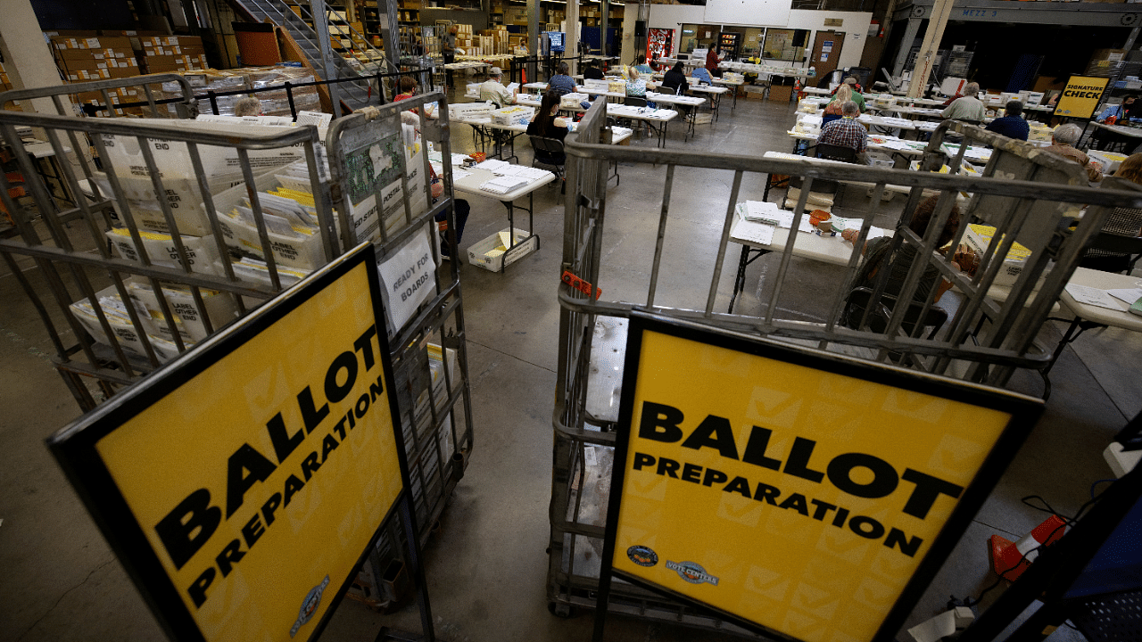 Some of the hundreds of thousands of early mail-in ballots are processed for scanning by election workers at the Orange County Registrar of Voters in Santa Ana, California. Credits: Reuters Photo
