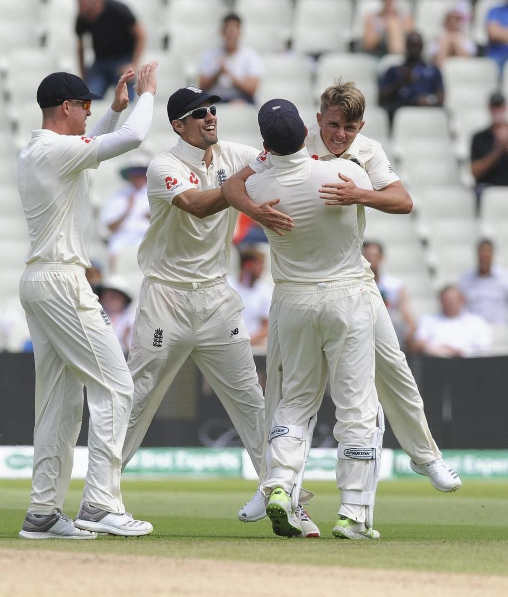 England's Sam Curran (right) celebrates with team-mates after dismissing India's K L Rahul on the second day of the first Test cricket at Edgbaston on Thursday. AP-PTI