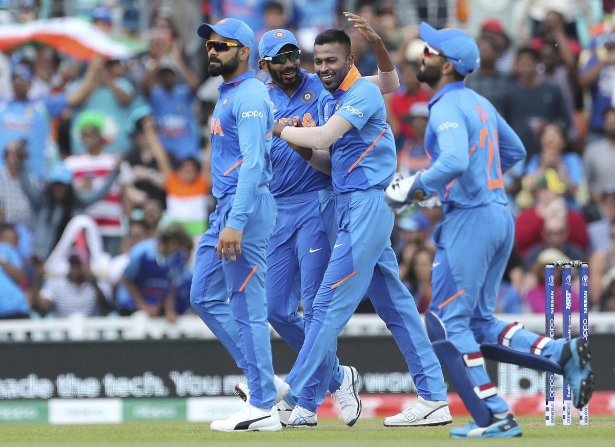 India's K L Rahul feels team-mate Hardik Pandya (centre) will have a successful World Cup. AP/PTI