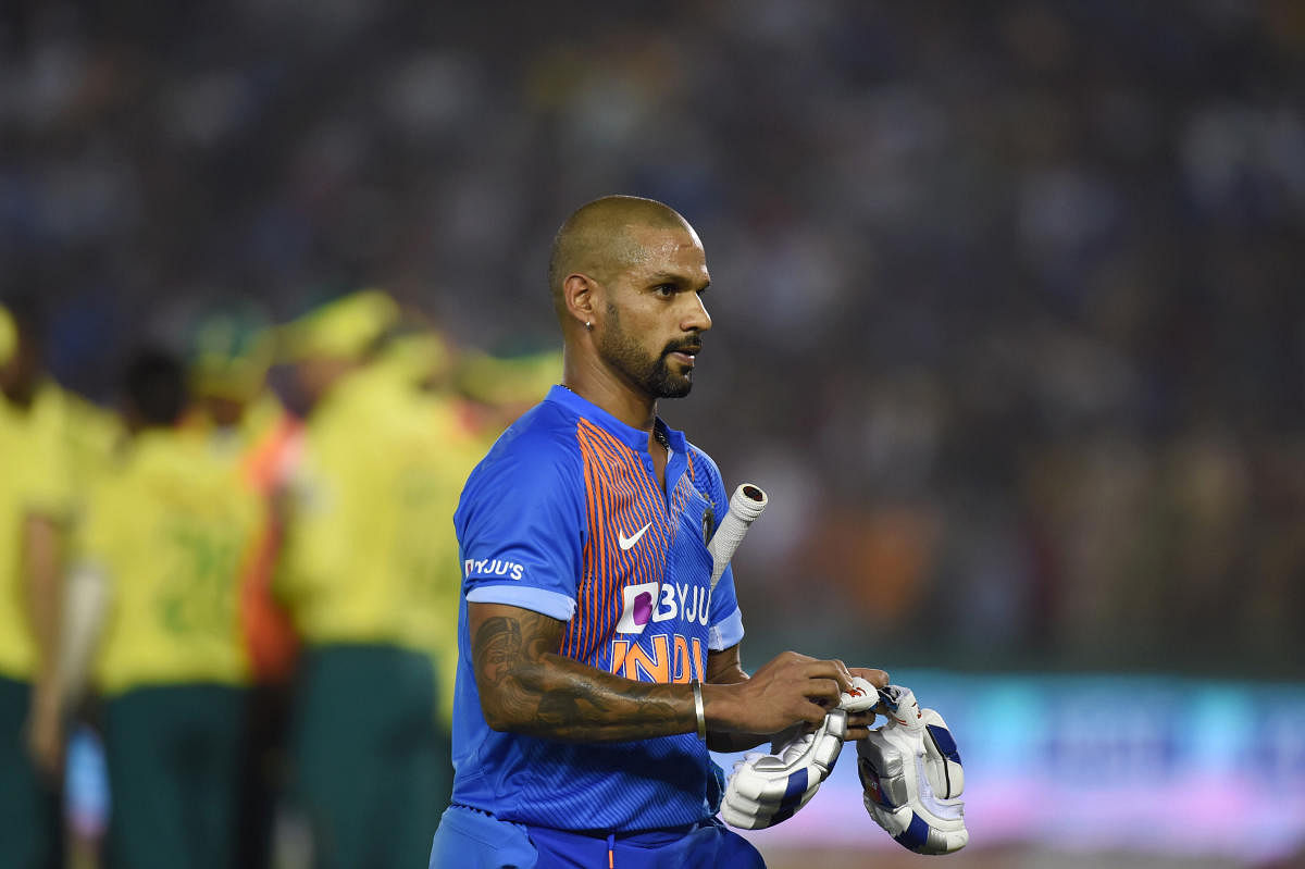 India's Shikhar Dhawan walks off the pitch after being dismissed. (PTI PHOTO)