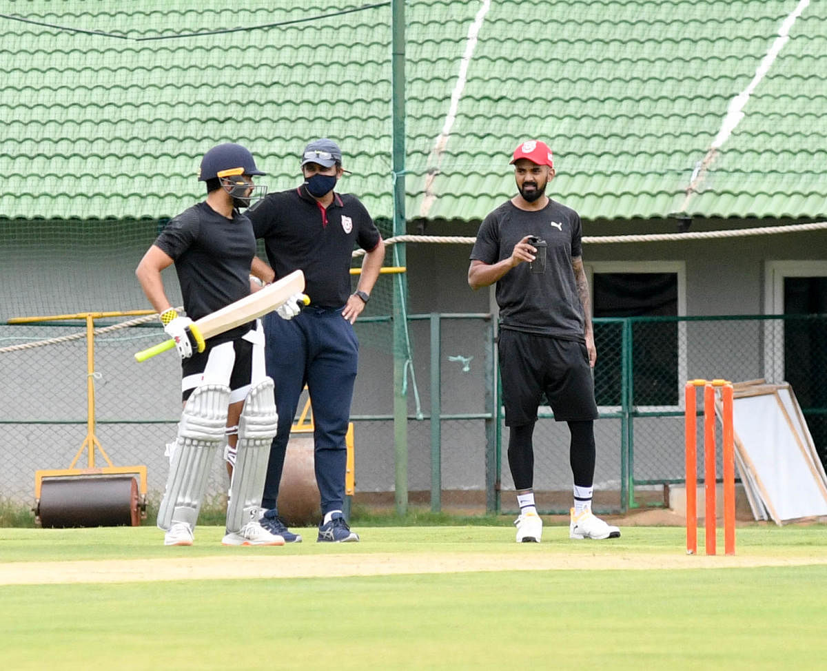 Kings XI Punjab's Head Coach Anil Kumble (centre) discusses a point with batsman Karun Nair as skipper KL Rahul looks on during a practice session at the Just Cricket Ground in Bengaluru on Friday. DH Photo/ B H SHivakumar