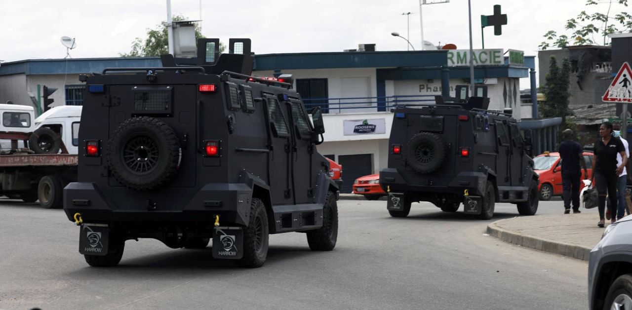 Riot police vehicles patrol a street after a clash with protesters in Abidjan, Ivory Coast. Credit: Reuters