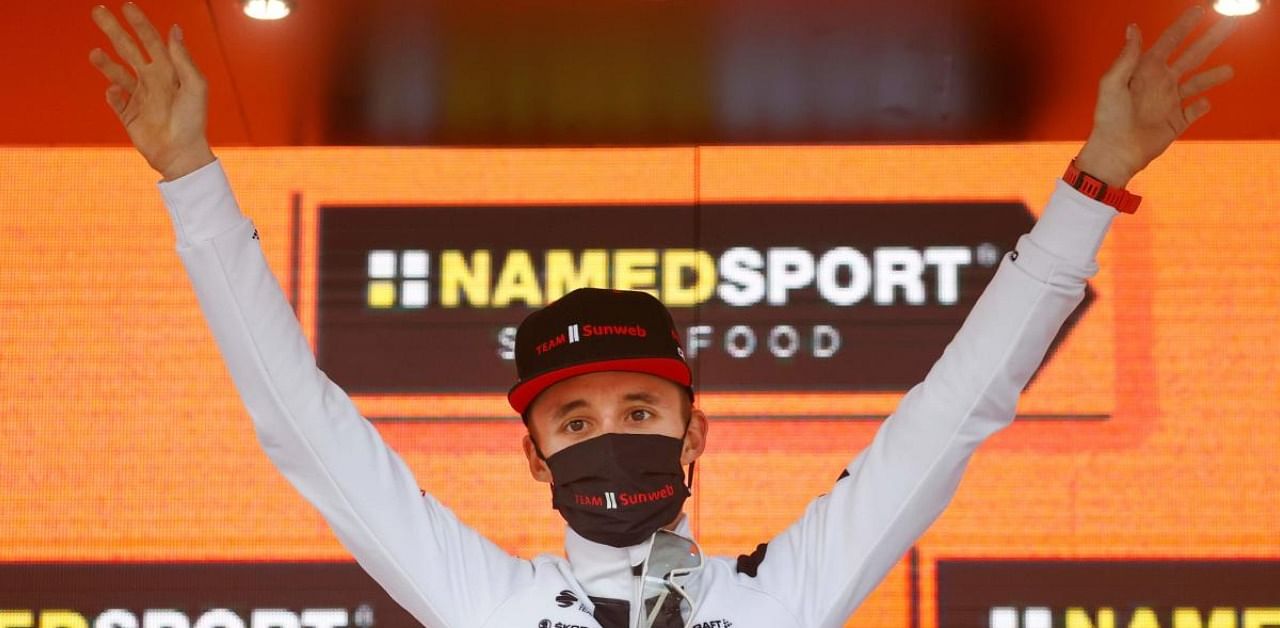 Team Sunweb rider Australia's Jai Hindley celebrates on the podium after winning the 18th stage of the Giro d'Italia 2020 cycling race. Credit: AFP