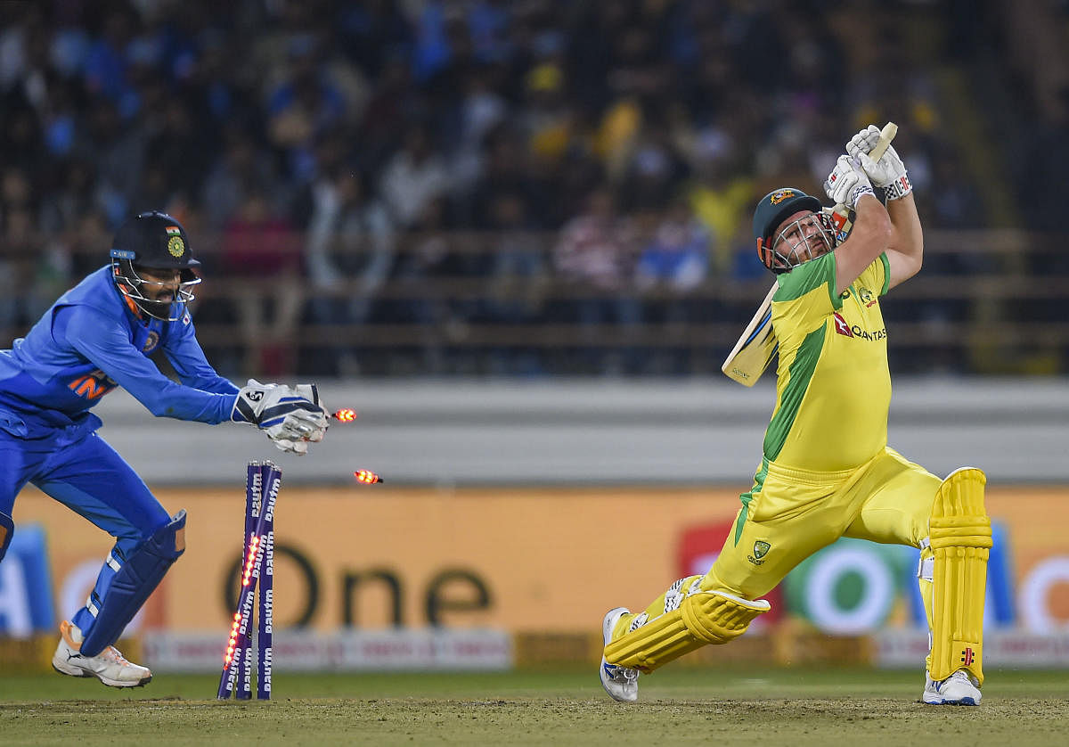 Australian batsman Aaron Finch being stumped by Indian wicket-keeper KL Rahul during the second one day international (ODI) cricket match between India and Australia at Saurashtra Cricket Association Stadium in Rajkot. PTI