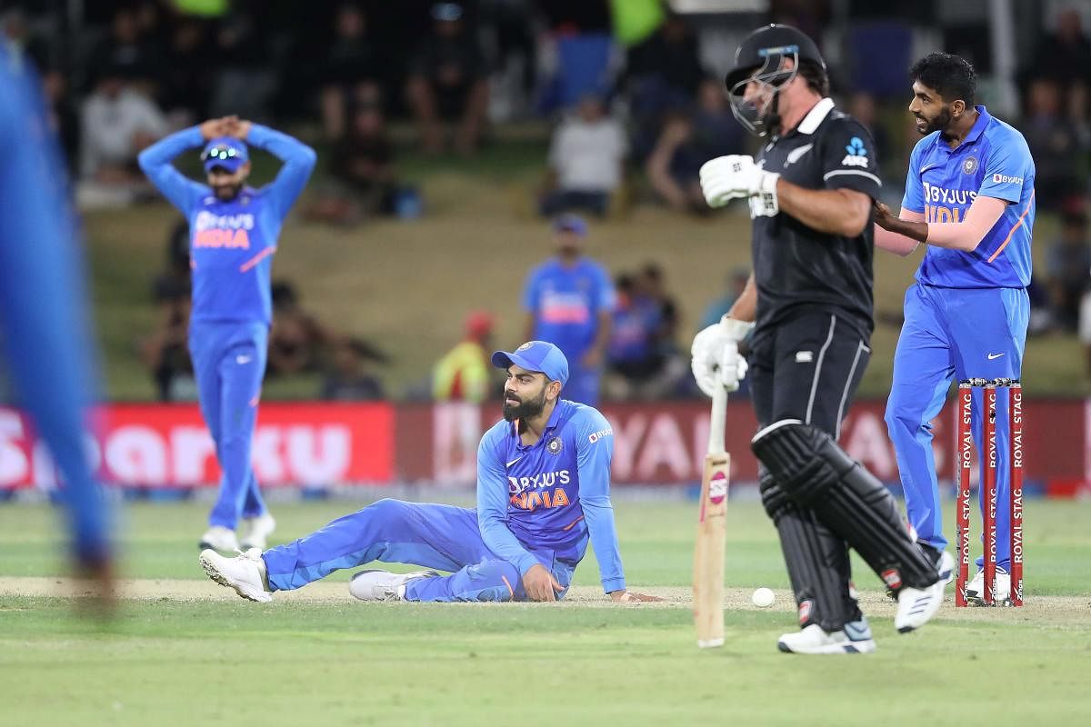 Virat Kohli (C) reacts during the third one-day international cricket match between New Zealand and India. (AFP Photo)