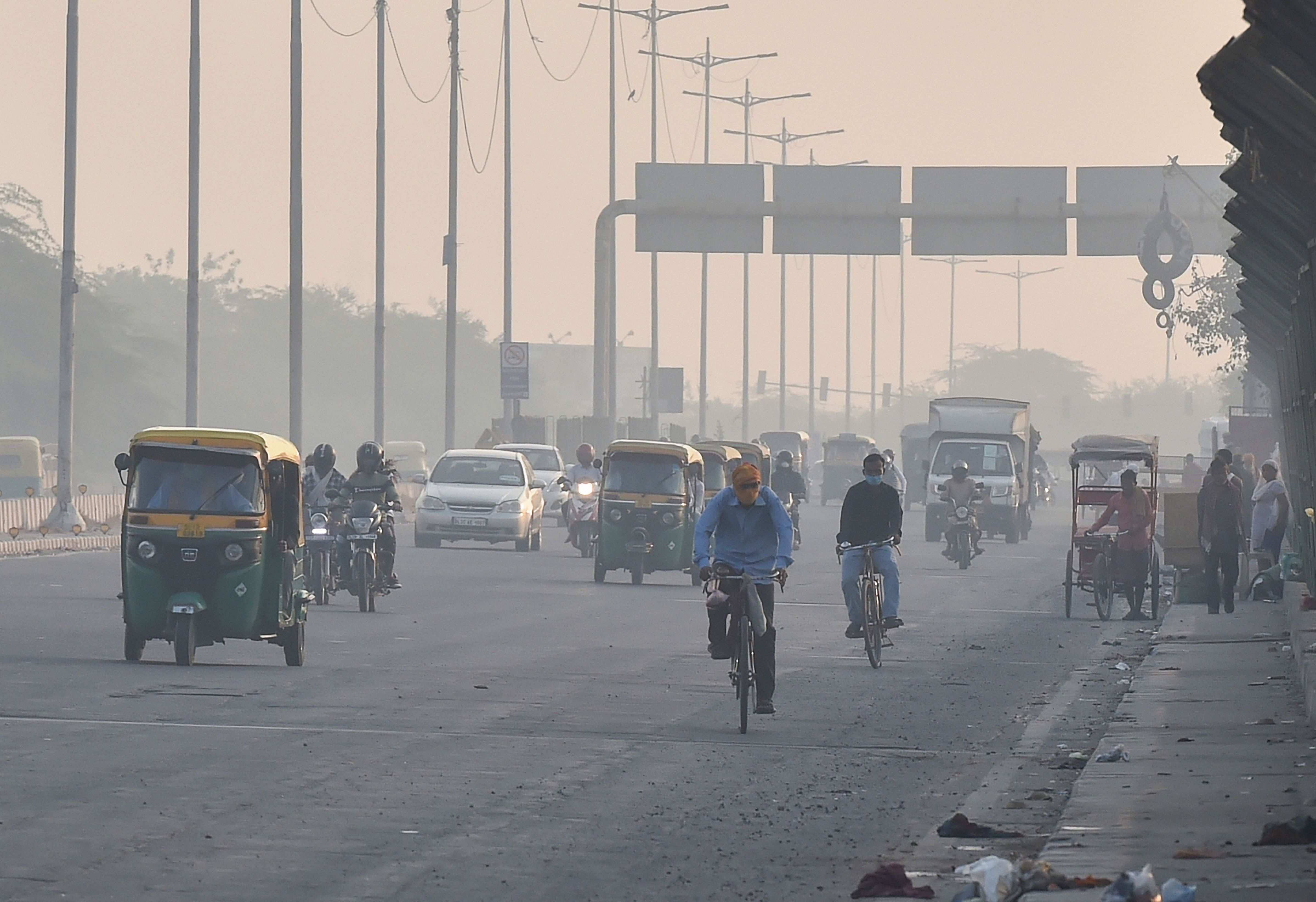Vehicles ply amid hazy weather conditions, in New Delhi. Credits: PTI Photo