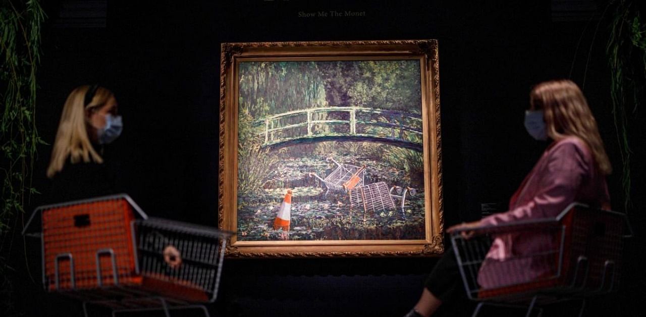 In the 2005 work, Banksy added abandoned shopping carts and an orange traffic cone to Claude Monet's image of water lilies in his garden at Giverny. Credit: AFP Photo