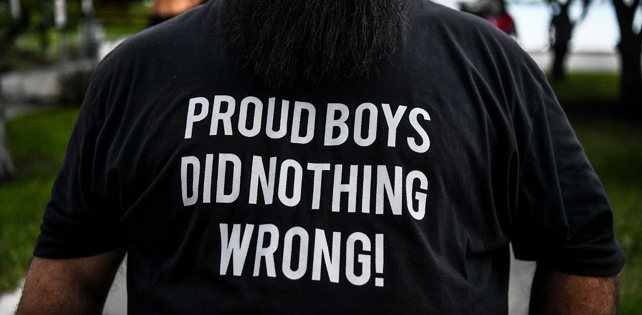 A supporter of US President Donald Trump wears a "Proud Boys" shirt prior to his arrival for NBC News town hall event at the Perez Art Museum in Miami. Credit: AFP Photo