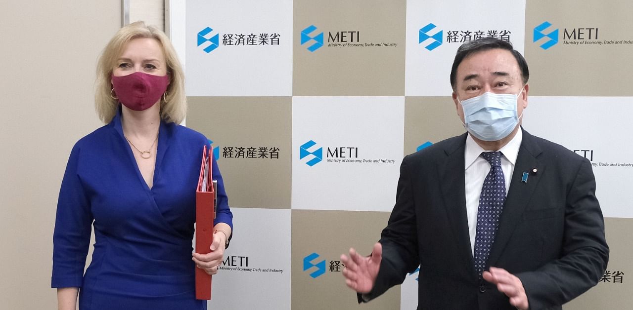 British Secretary of State for International Trade Elizabeth Truss and Japan's Economy, Trade and Industry Minister Hiroshi Kajiyama gather prior to their talks in Tokyo. Credit: AFP Photo