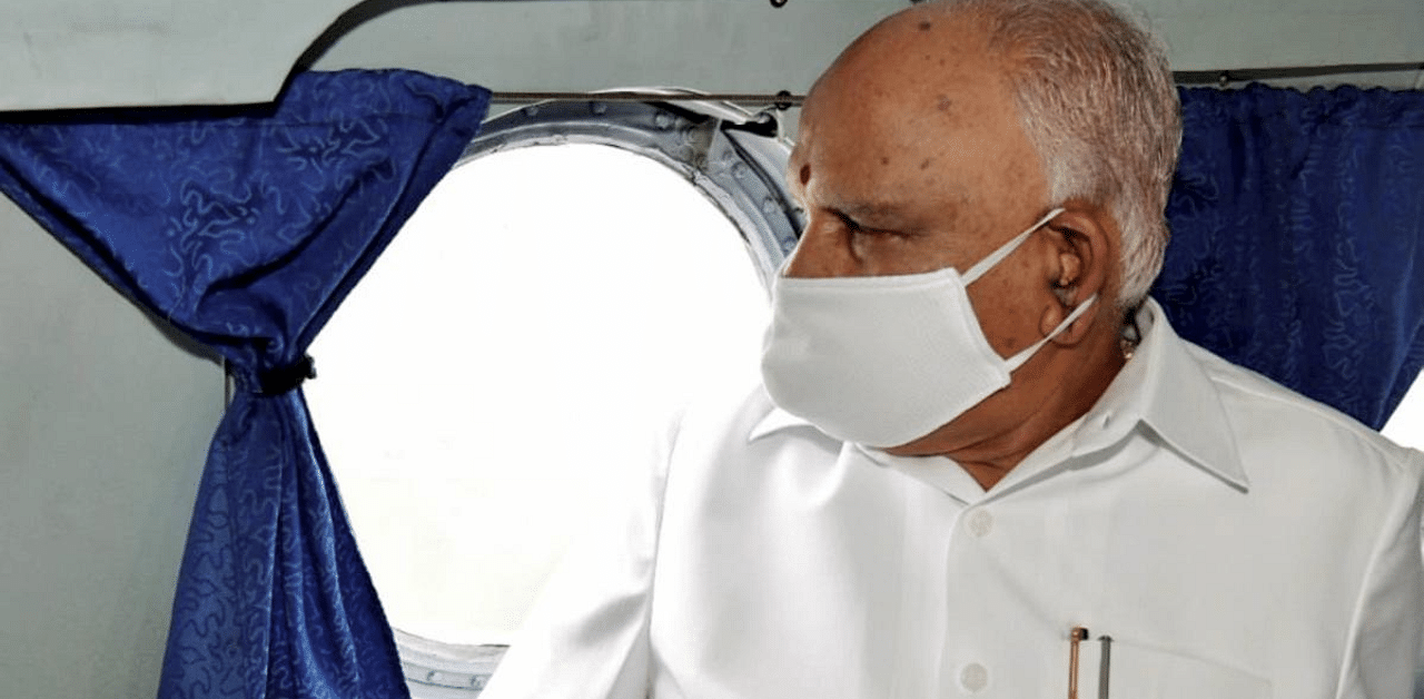  Karnataka CM BS Yediyurappa during an aerial survey to assess the extent of damage caused by the heavy rains in various district of Karnataka state. Credit: PTI Photo