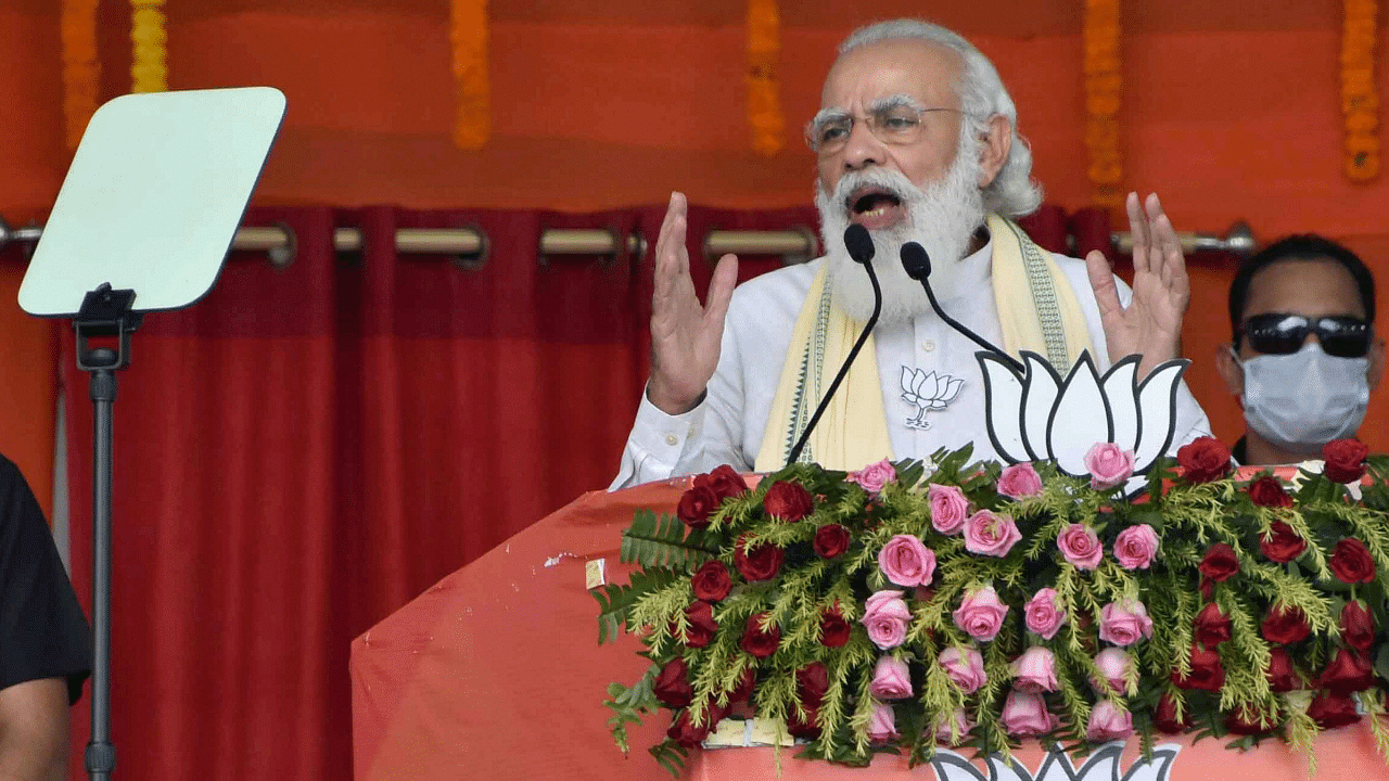 Prime Minister Narendra Modi addresses a gathering during an election rally. Credits: PTI Photo
