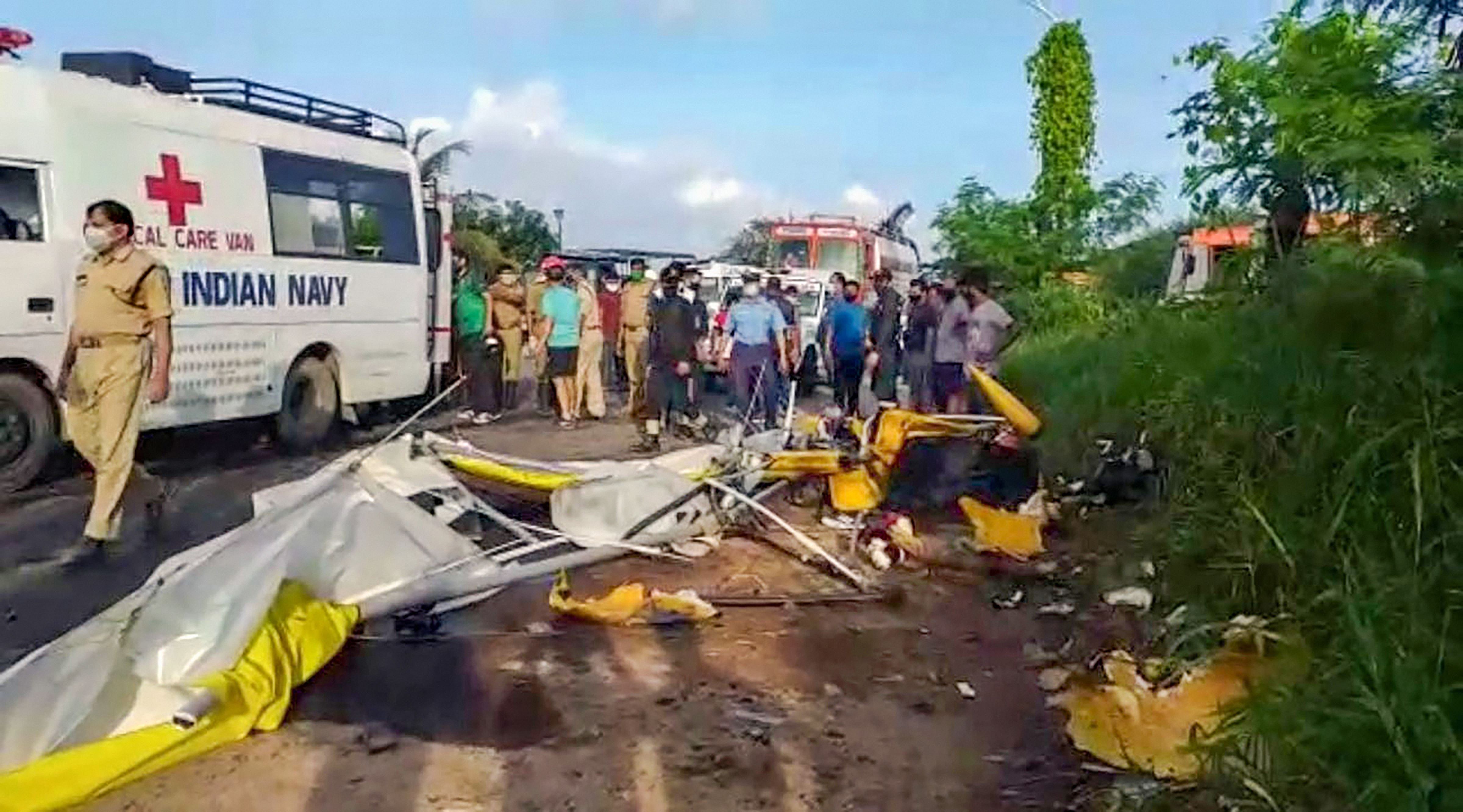 Mangled remains of a naval power glider after a crash during a routine training sortie near Thoppumpady bridge, in Kochi. Credits: PTI Photo