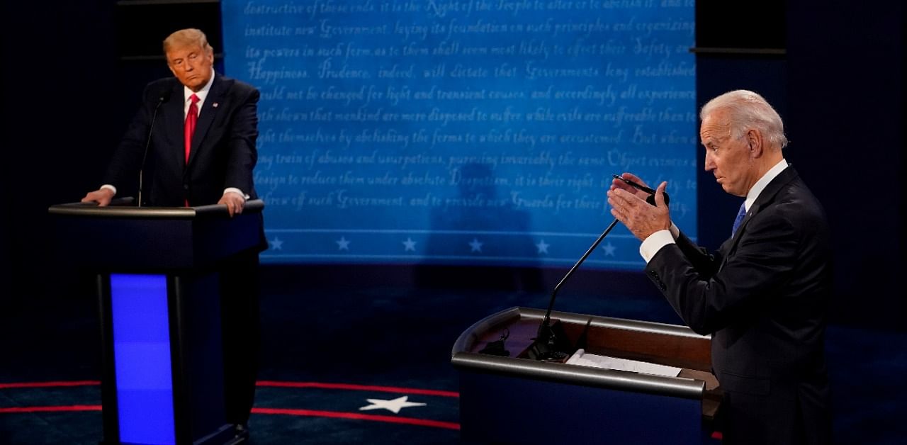 Democratic presidential candidate former Vice President Joe Biden answers a question as President Donald Trump listens during the second and final presidential debate. Credit: Reuters Photo