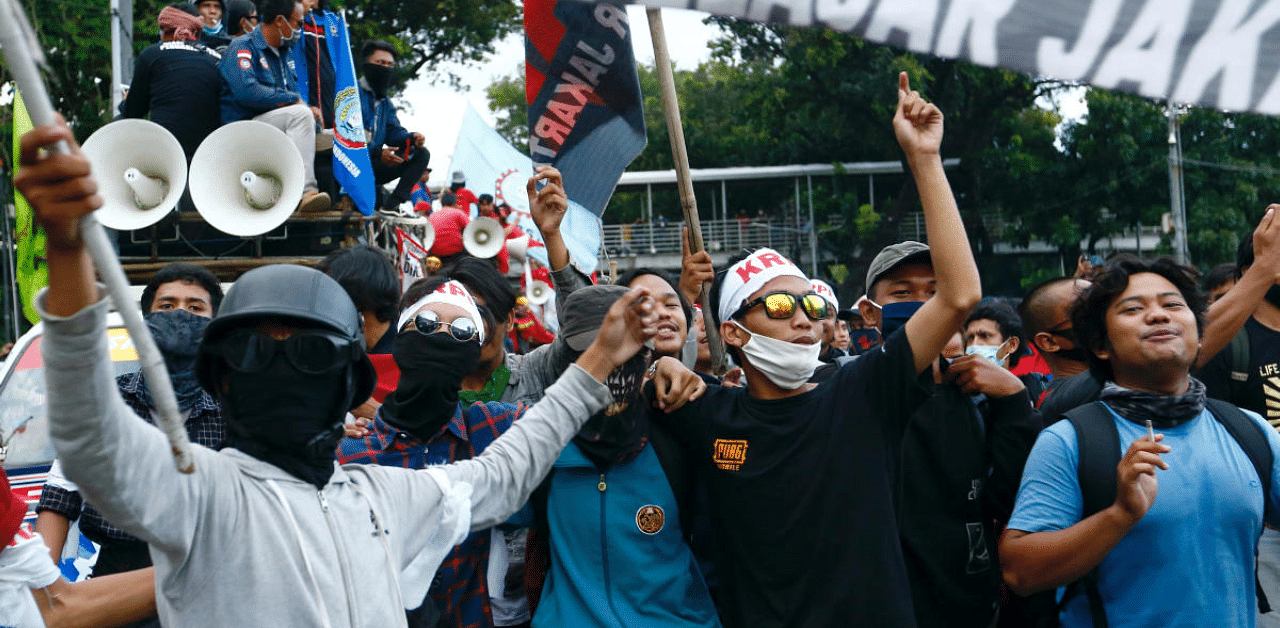 Demonstrators gesture at a protest against the government's labor reforms in a "jobs creation" bill in Jakarta, Indonesia. Credit: Reuters Photo