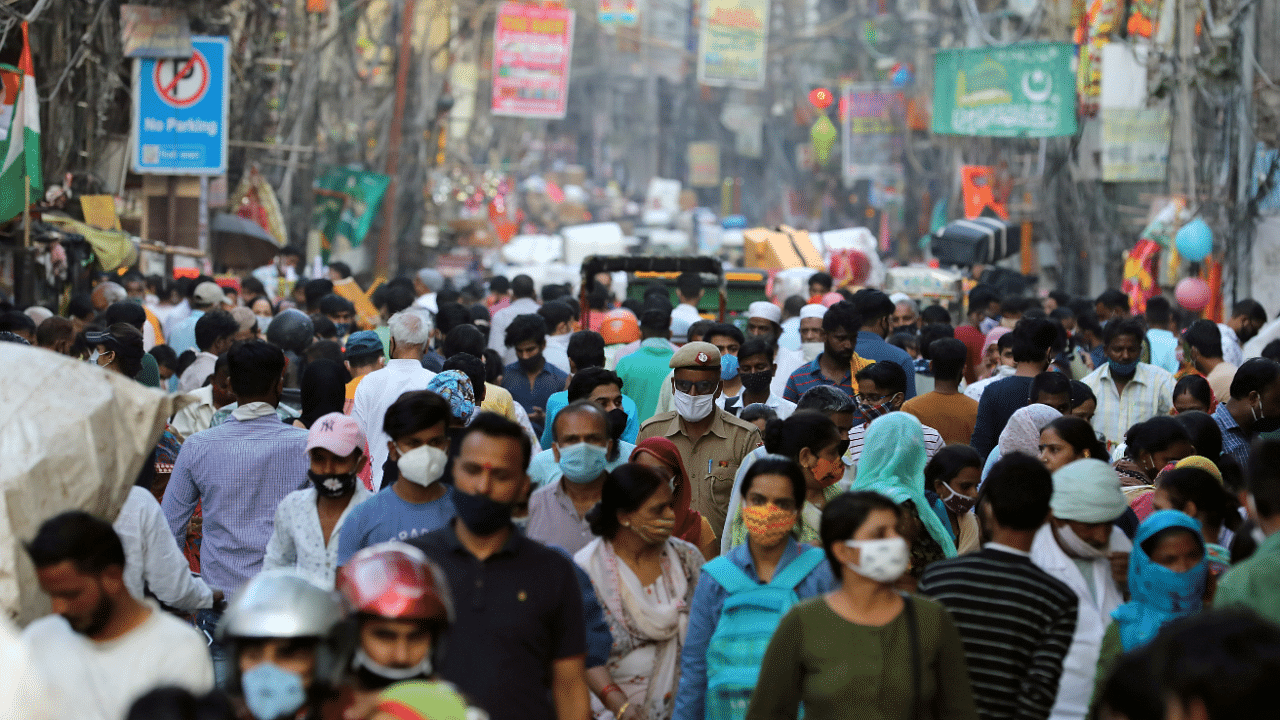 People are seen at a market amidst the spread of the coronavirus disease. Credits: Reuters Photo