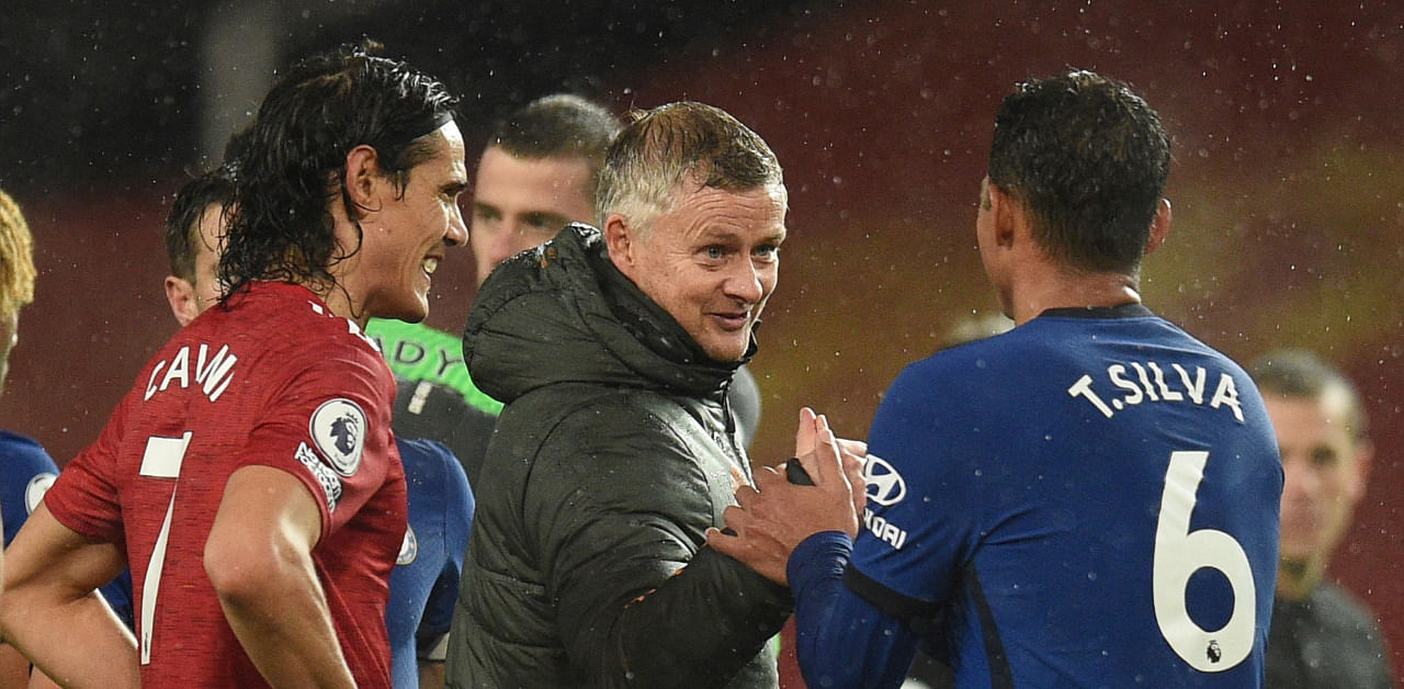 Manchester United manager Ole Gunnar Solskjaer, Manchester United's Edinson Cavani and Chelsea's Thiago Silva after the match. Credit: Reuters Photo