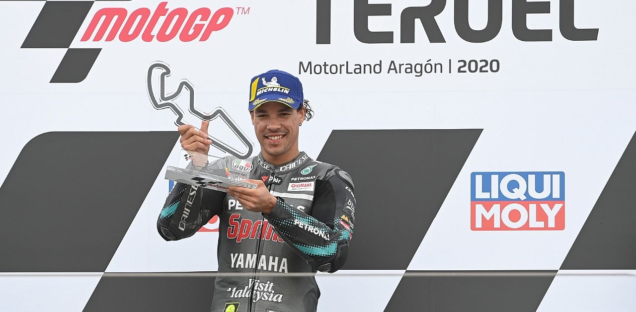 Petronas Yamaha SRT's Italian rider and winner Franco Morbidelli celebrates on the podium after the MotoGP Grand Prix of Teruel at the Motorland circuit in Alcaniz. Credit: AFP
