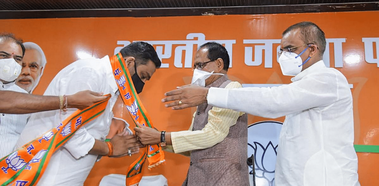 Congress MLA from Damoh, Rahul Lodhi joins BJP in the presence of Madhya Pradesh CM Shivraj Singh Chouhan and State BJP president V.D. Sharma at party office in Bhopal. Credit: PTI Photo